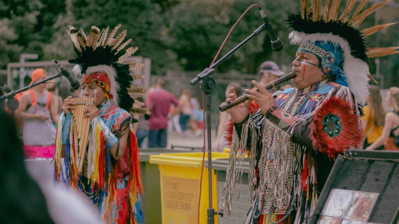 Native American musicians performing outdoors in traditional wear with woodwind instruments., tags: grand junction - pexel